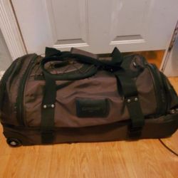 Samsonite Duffle bag...large Size ..with Wheels And Carry Strap..Good CONDITION 