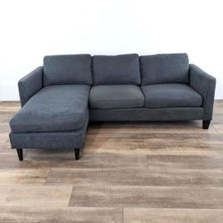 Dark Gray Modern Sectional Sofa with Reversible Chaise from Living Spaces