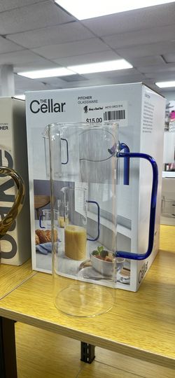 Glass pitcher with blue handle