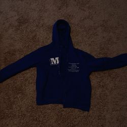 Blue Hoodie With a M ON It Idk
