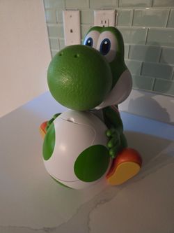 Brand new yoshi popcorn bucket still in its plastic bag.