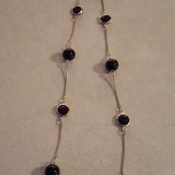 30 inch silver necklace with black beads very pretty... new