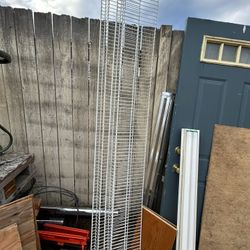 Two White metal shelves