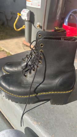 Dr. Martens women's Shriver Hi leather boots in black with a platform sole.