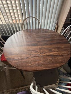 Oval wooden table with 4 chairs