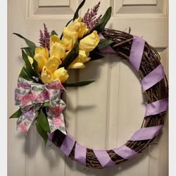 Wreath for front door 22” New. Faux silk yellow tulips. Lilac fabric  ribbon. Ships in its own box. Cones from a smoke free environment.  