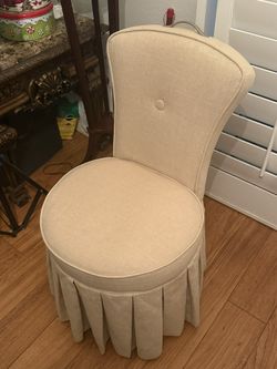 Beige Upholstered Accent Chair with Skirted Base