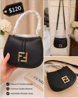 Black structured shoulder/crossbody bag with gold-tone hardware and adjustable strap. ✨