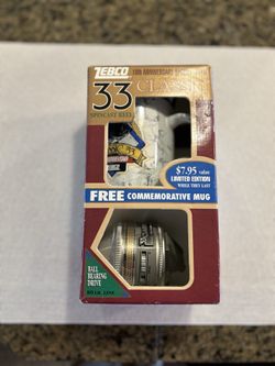 Collectible Zebco Reel And Mug.  