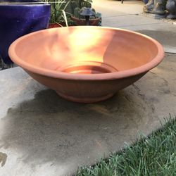 An x-large flat Italian are terracotta pot