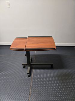Desk with wheels and adjustable