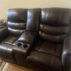 2 brown reclining leather couches