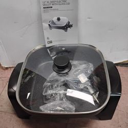 Elite Gourmet electric skillet with a glass lid.