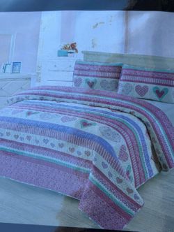 Pink and purple heart themed bed spread