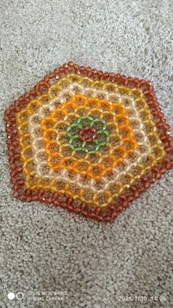 Small decorative beaded placemate