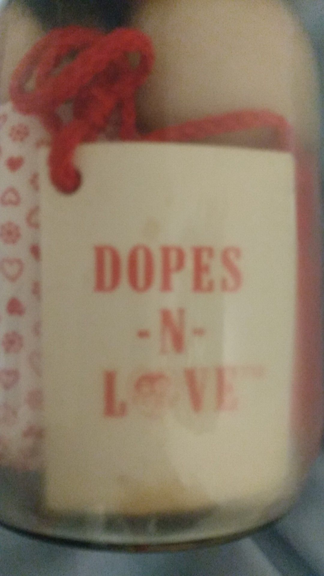 Antique "Dopes In Love" inside of an old fashioned mason jar