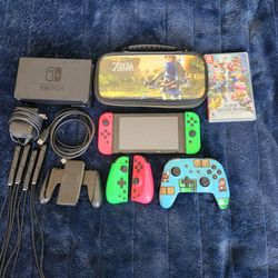 Nintendo Switch Bundle With Super Smash Bro, Zelda Carrying Case, And Extra Controllers