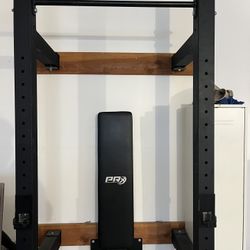 Folding wall mounted squat rack and pull up bar