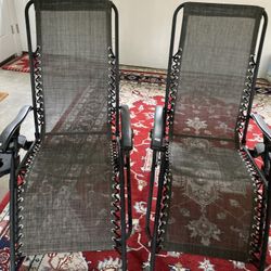Two Black Reclining Outdoor Chairs