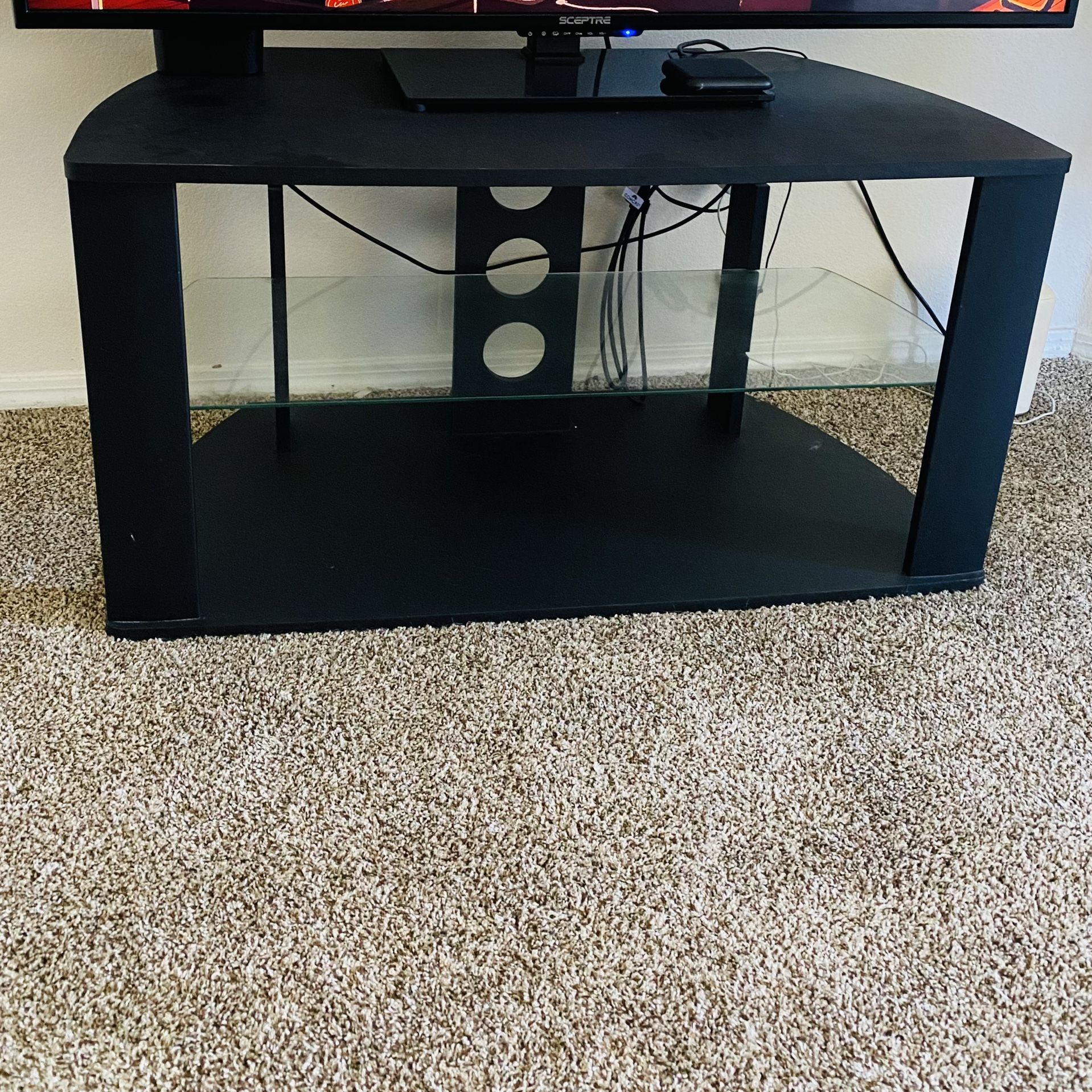 Black TV stand with glass top