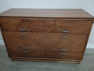 Wooden dresser with drawers.