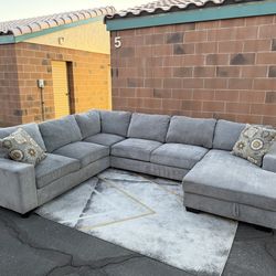 Light Grey Sectional with storage/pull out bed