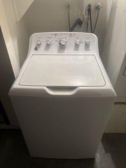 GE High-Efficiency Top-Load Washing Machine, specifically from the GE GTW465 series (model GTW465ASNWW)