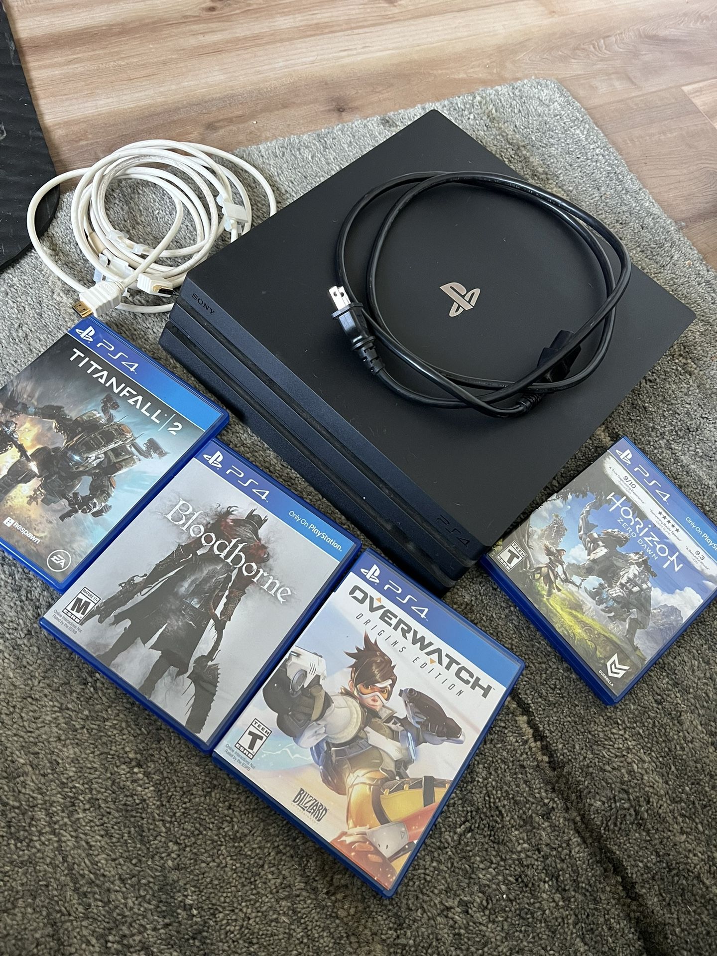 PS4 Pro Console, Cables, 4 Free Games. No Controller