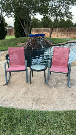 Patio conversation set with 2 rocking chairs and matching glass-top table.
