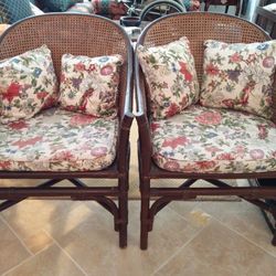 1 set of designer rattan arm chair (2 chairs) with cushions, also 1 matching side/coffee/corner table - by McGuire Furniture Company