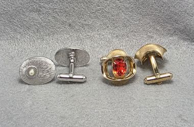 2 Pair Cuff Links. 1-Orange Rhinestone Pinched Ribbon Design. 2-imiration Pearl Burst Desinn