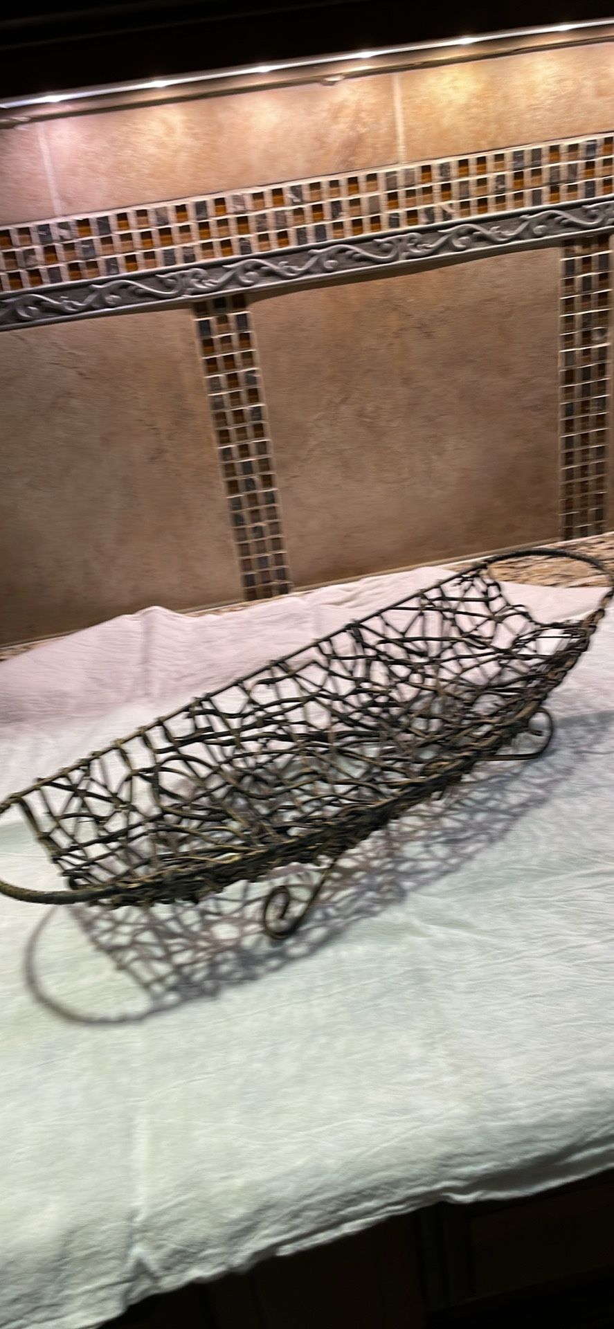 Oblong Brown Wicker Basket On Gold Stand