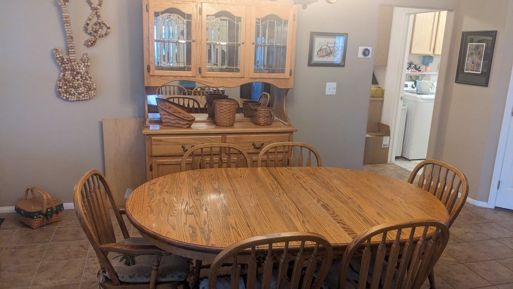 Oak Dining Table, Chairs, And Hutch