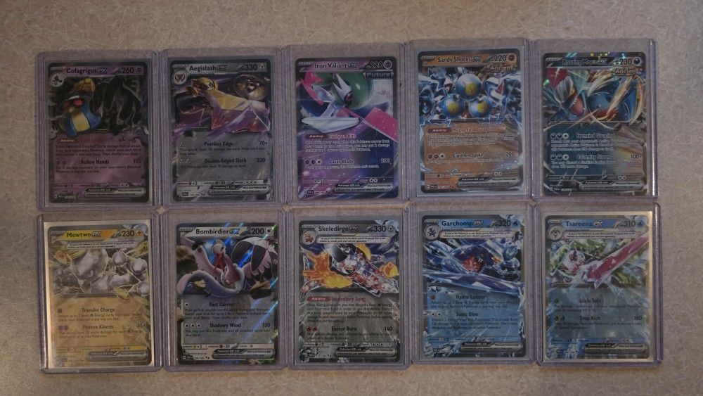 Almost completed base set Pokémon Paradox Rift. 206 cards plus 10 EX cards. 216 cards total.