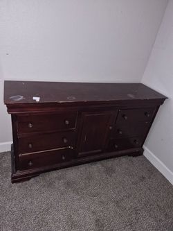 Dark Wood Dresser with Multiple Drawers