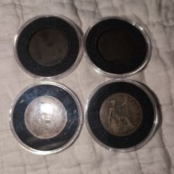 Great Britain One Penny coin featuring the seated figure of Britannia.