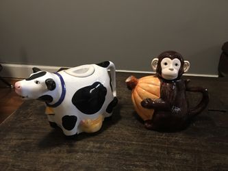 2 ceramic tea pots. Beautiful and lovely .