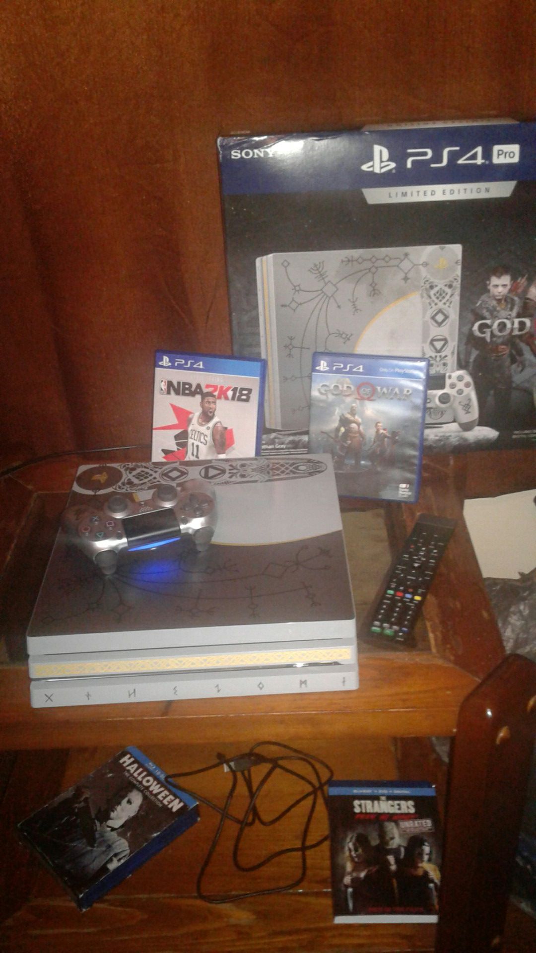 i have limited edition god of war new barely played perfect condition 1 tb ps4 pro with 1 controller and dvd remote