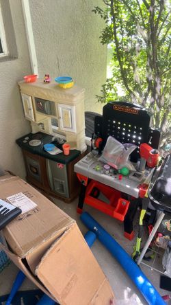 Play kitchen, dollhouse, toy workbench and tools