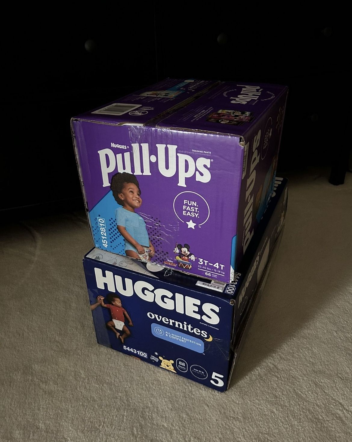 2 boxes of huggies diapers, 154 count (for toddler over 27 lbs)