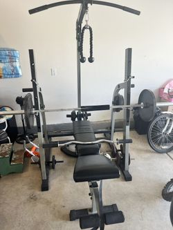 Nautilus Multi-Adjustable Bench, Olympic Bars, Curl Bar And Discs