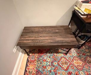 Coffee table with lift up desk/table.