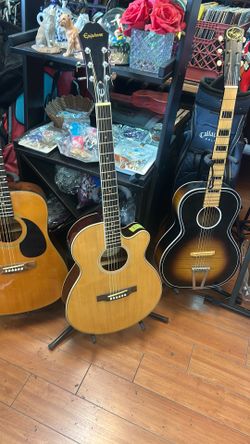 Epiphone PR-4E acoustic-electric guitar in a natural finish