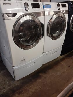 Samsung front load washer and dryer set with pedestal working perfectly with 4 months warranty