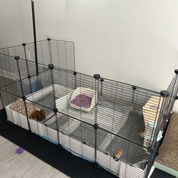 Small animal enclosure with food and bedding and all accessories