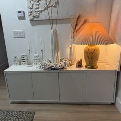 Hanson White Rectangular TV Stand for TV's up to 75"  Unique strips 3d doors. 70 inches long. 24 inches high, 15 1/2 inches deep. The measurement on t