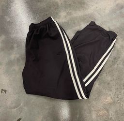 baggy parachute pants with white strips