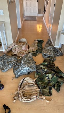 Lots of Military rain jackets apparel size, small, medium, and large