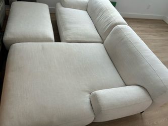 Cream white sectional with ottoman