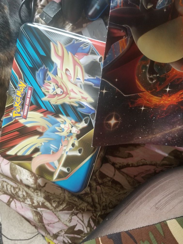 pokemon tin with cards/album and poster